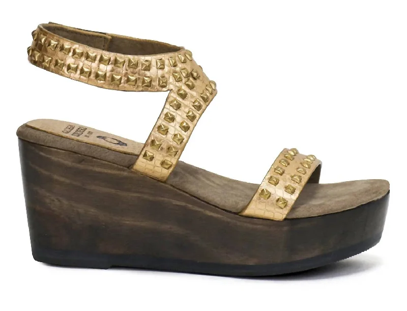 Stylish and practical women's shoes for rainy daysWomen's Mesa Wedge In Gold Python With Brass Art
